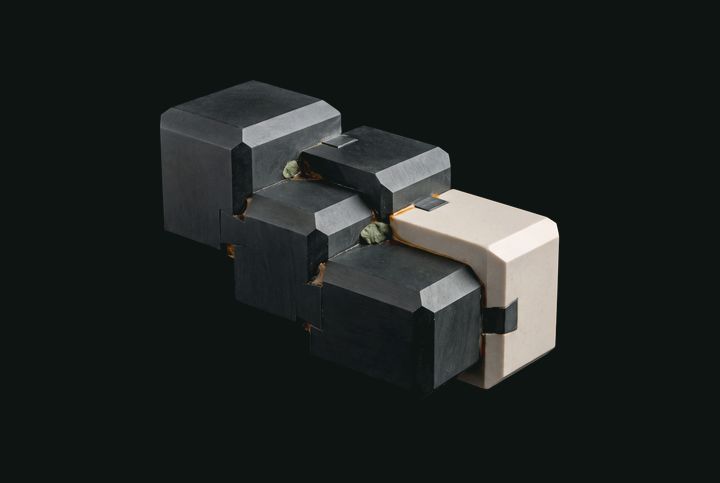 Interlocking ceramic and graphite components with precise joints.